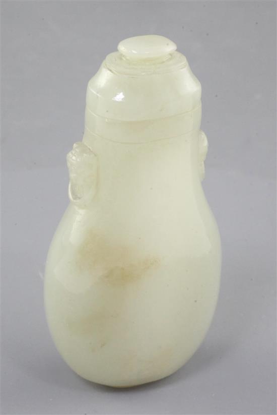 A Chinese pale celadon jade flattened baluster snuff bottle and cover, 19th century, 8.5cm